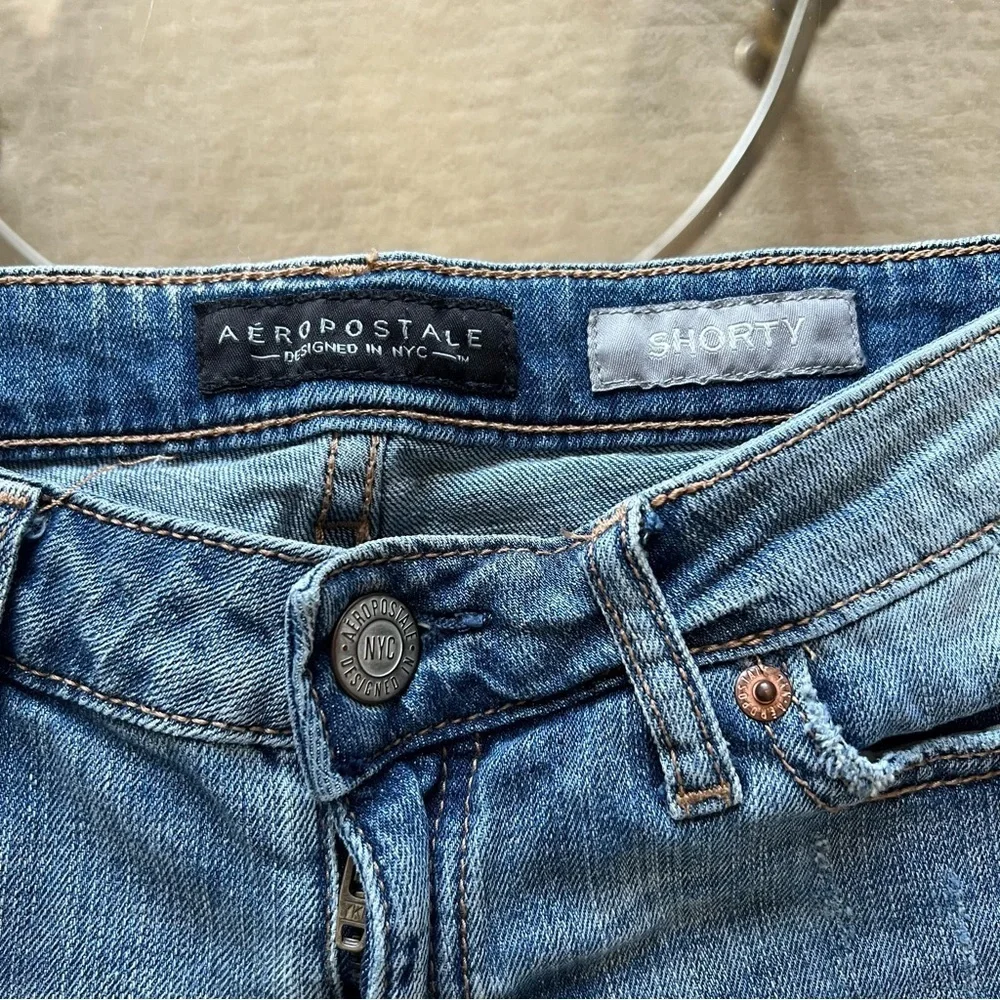 Distressed denim shorts.